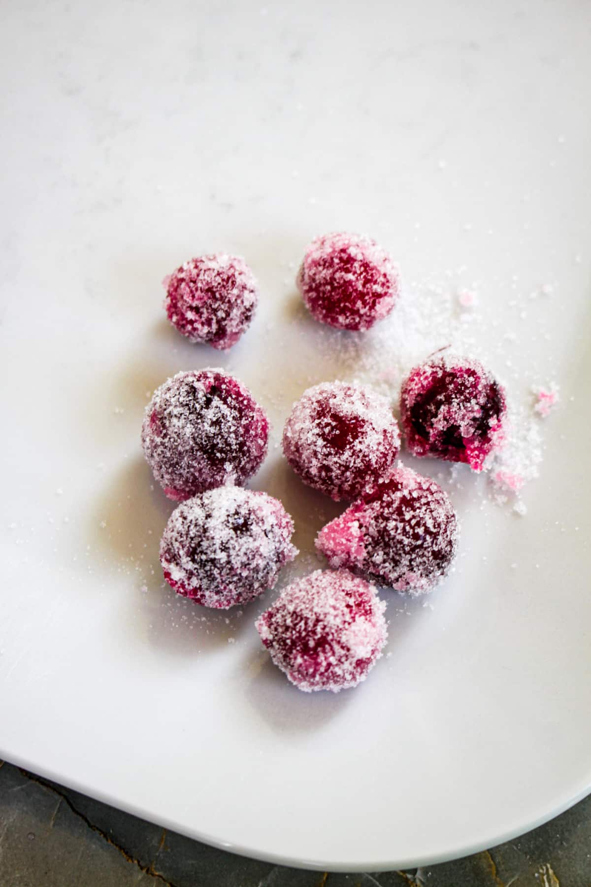 sugared cranberries on a small plate.