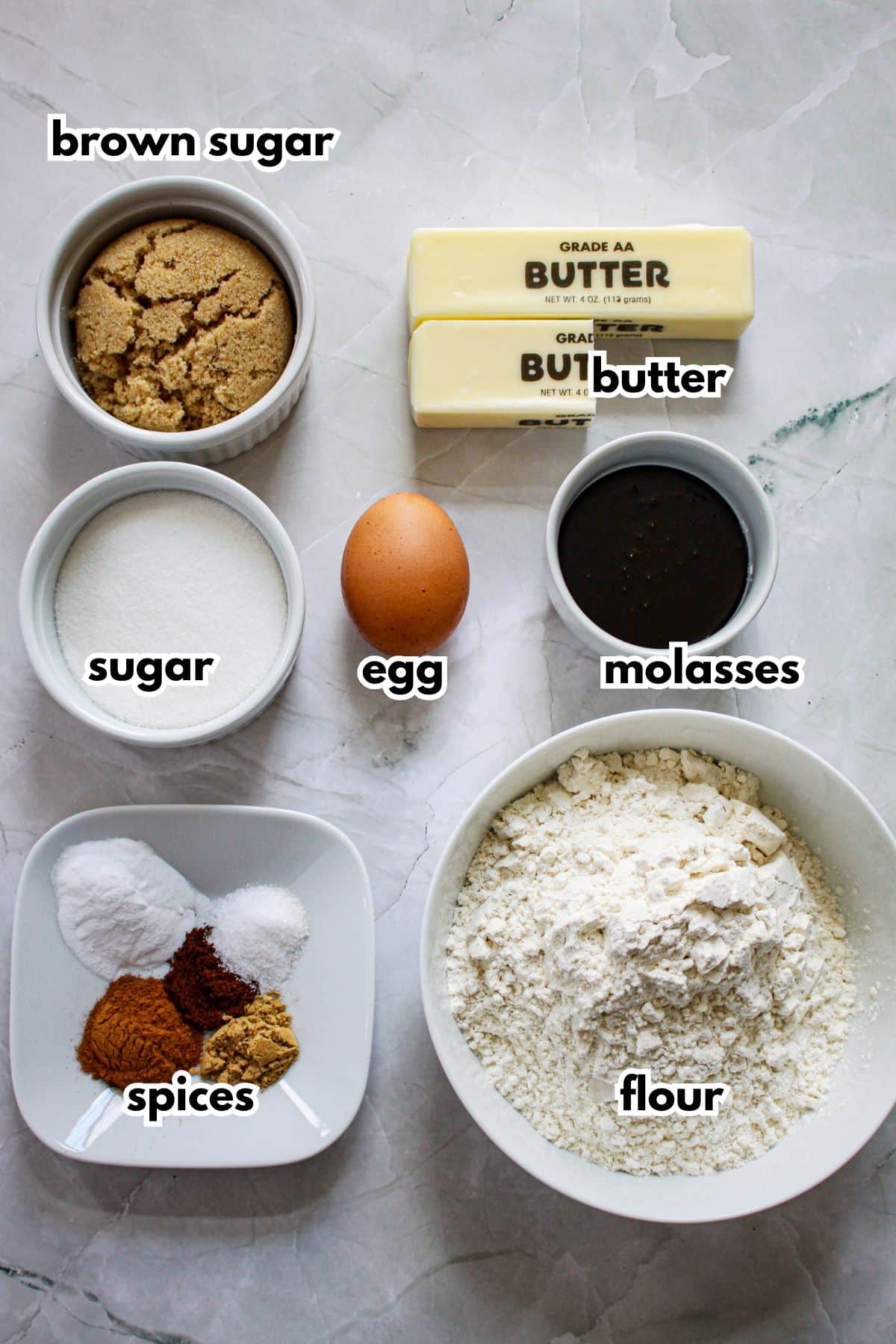bowls of butter, brown sugar, sugar, egg, molasses, spices, and flour.