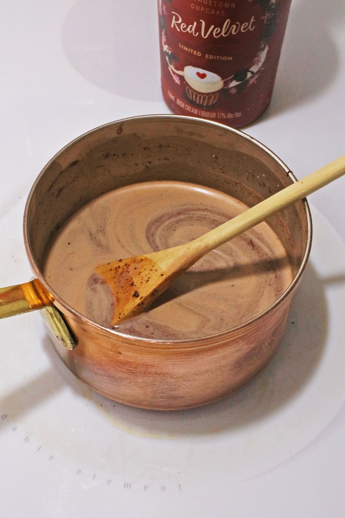 hot cocoa being made in a saucepan.