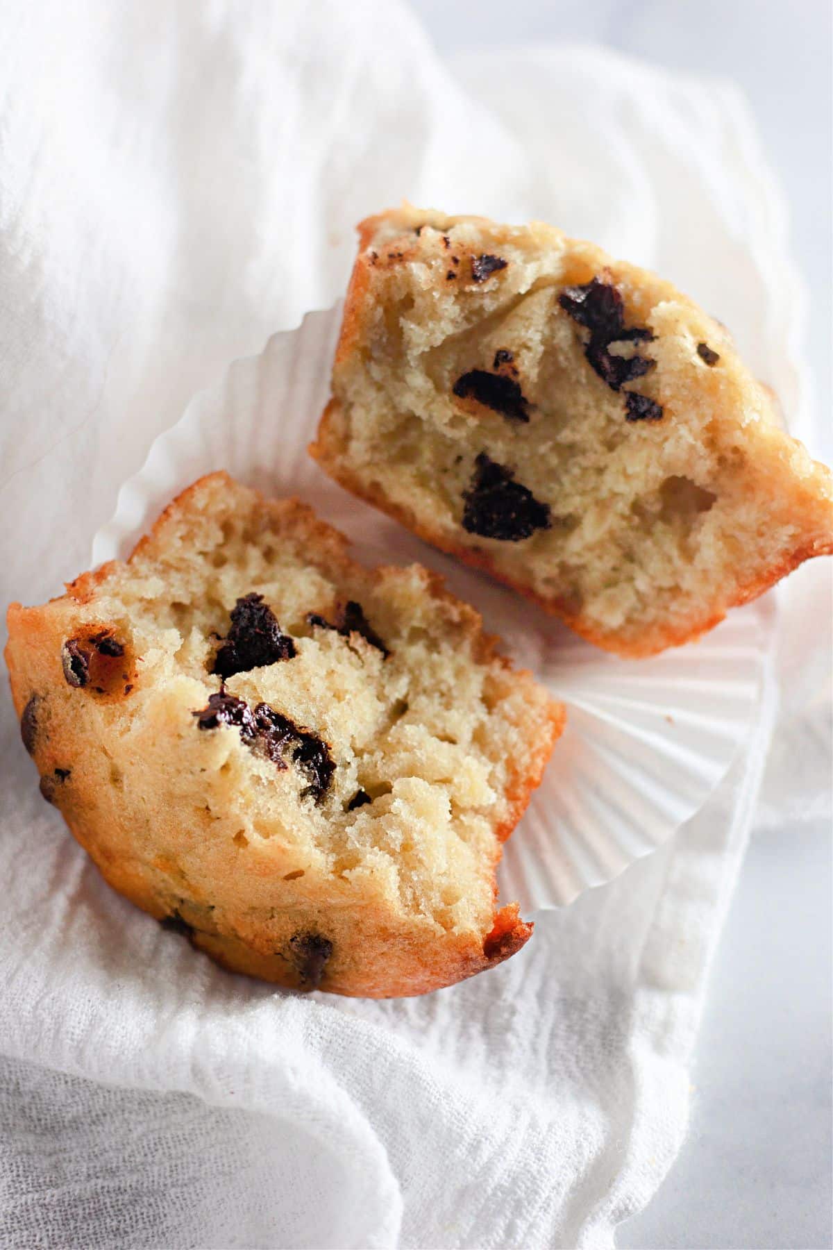 banana chocolate chip muffin spilt in half.