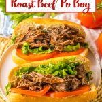 two slow cooker beef po boy sandwiches on a plate.