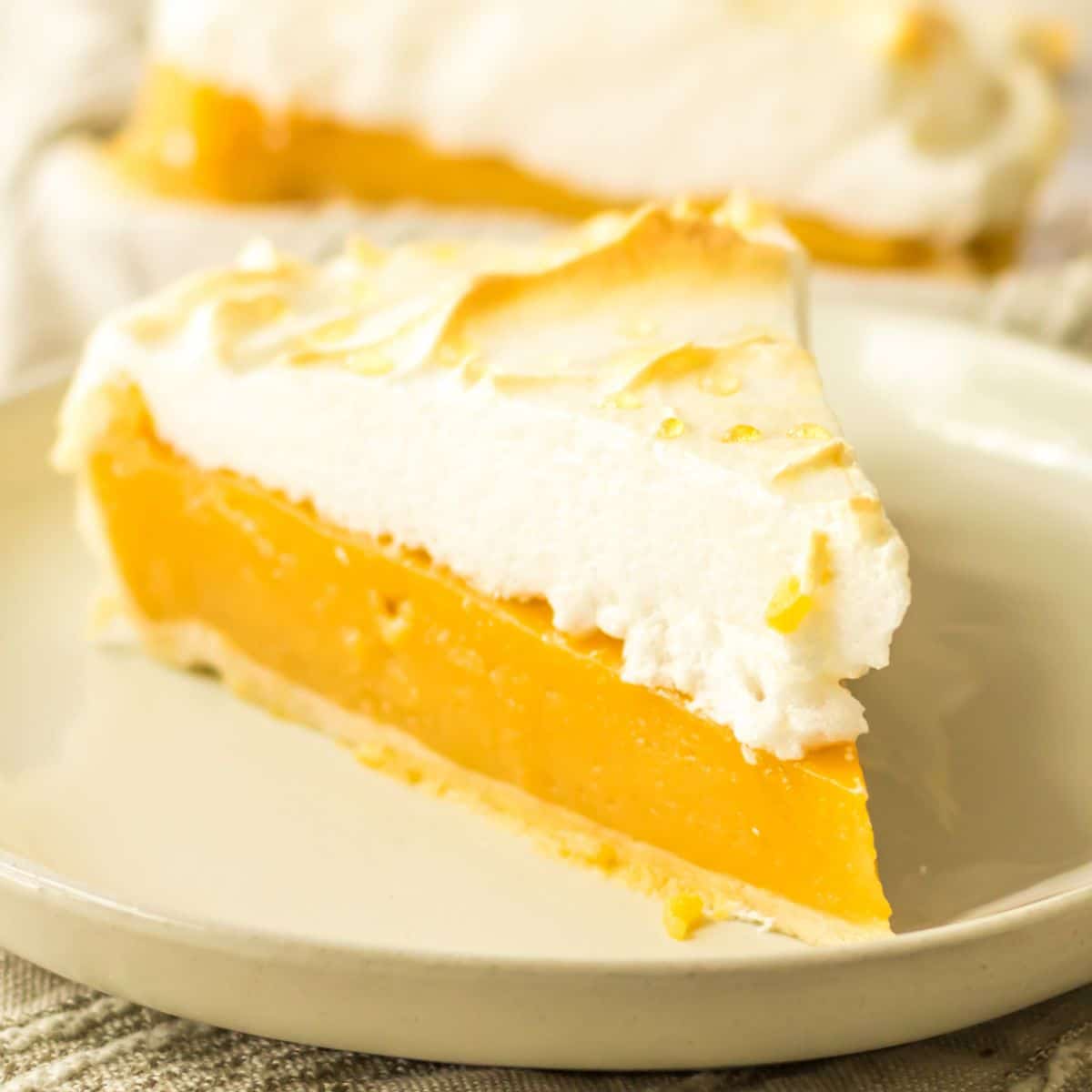 slice of butterscotch meringue pie on a plate.