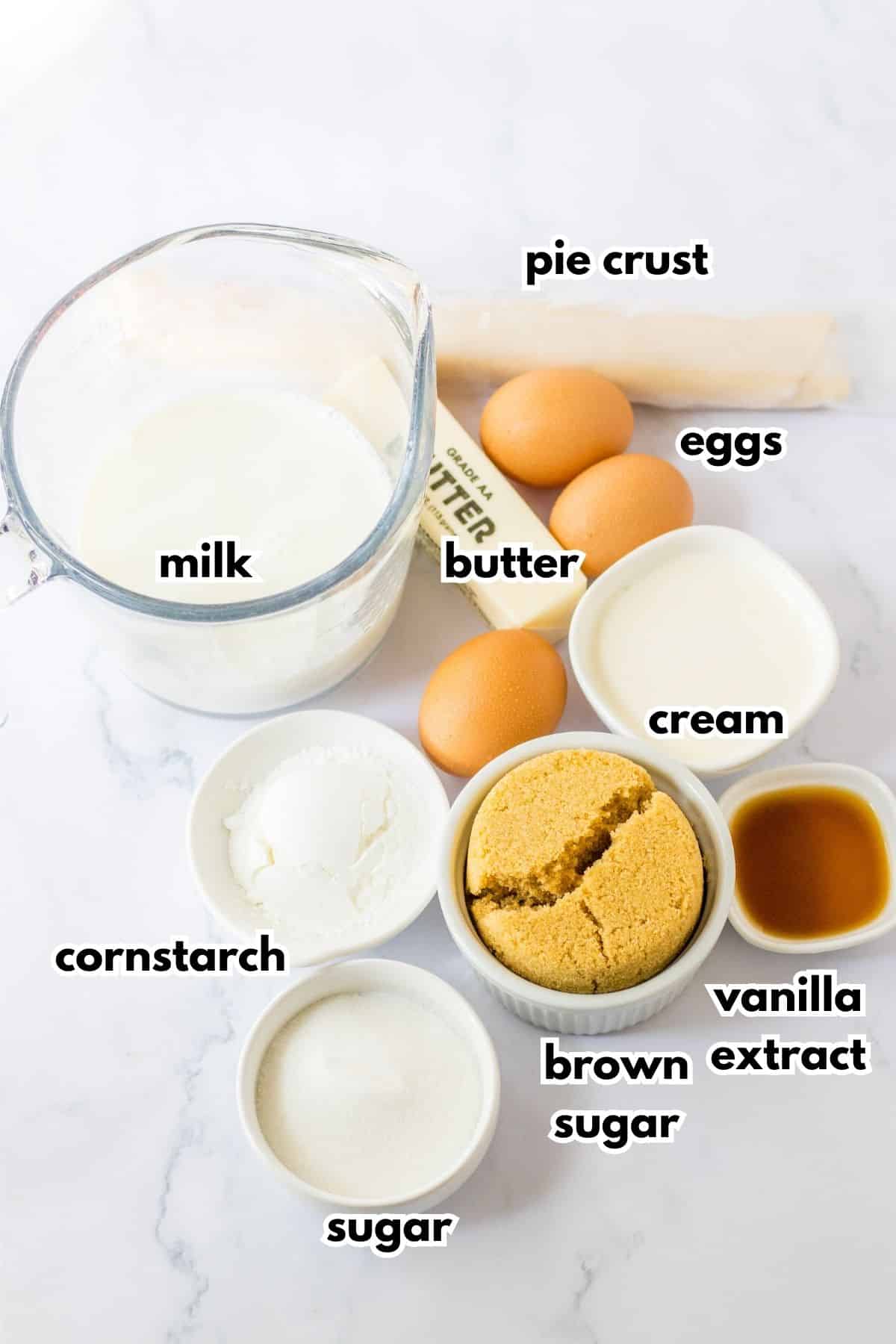 bowls of milk, pie crust, butter, eggs, cornstarch, sugar, brown sugar, vanilla extract, and cream.