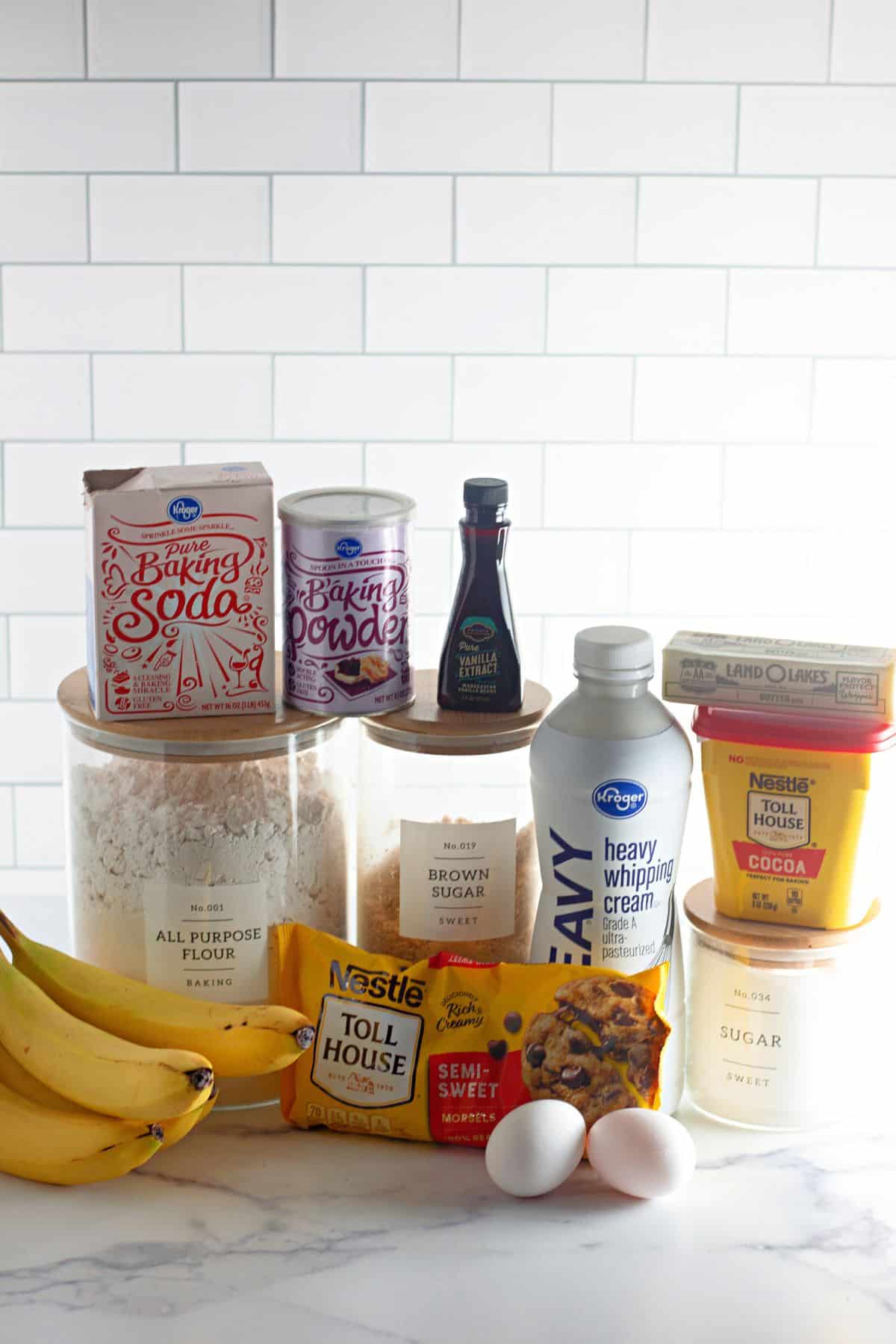 ingredients needed to make triple chocolate banana bread on a counter.