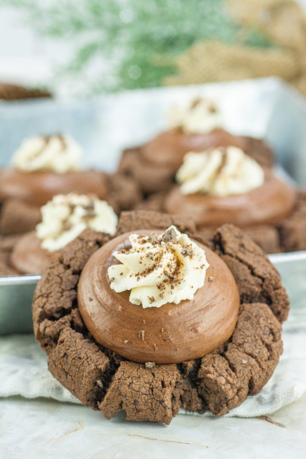 chocolate silk cookies on a kitchen towel.