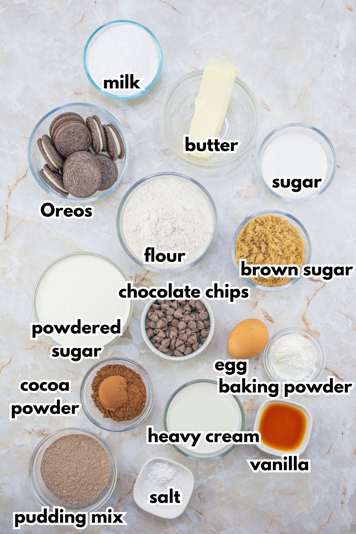 bowls of ingredients for chocolate silk cookies laid out on a counter.