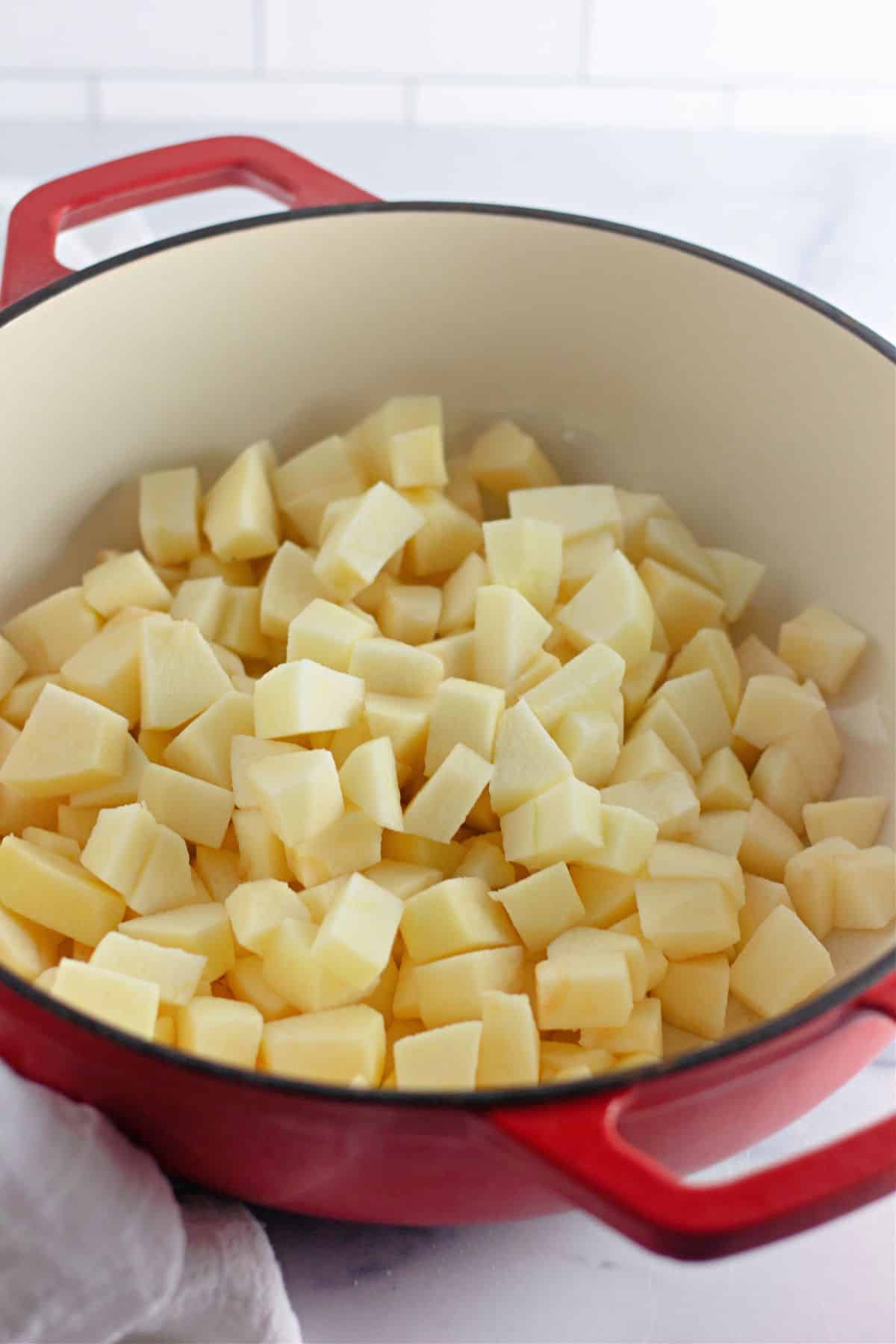 raw chopped apples in a saucepan.
