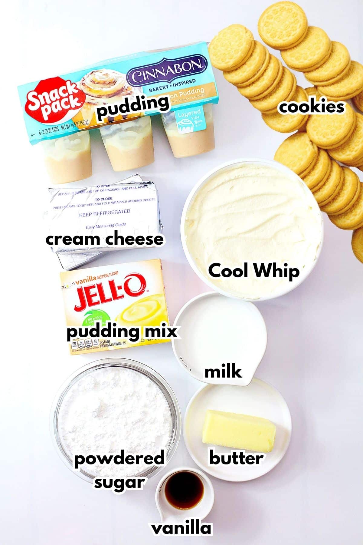 bowls of cinnabon pudding, cream cheese, cool whip, pudding mix, milk, powdered sugar, butter, vanilla, and golden oreo cookies.