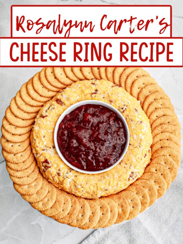 cheese ring on a platter with jam in the center and crackers on the outside.