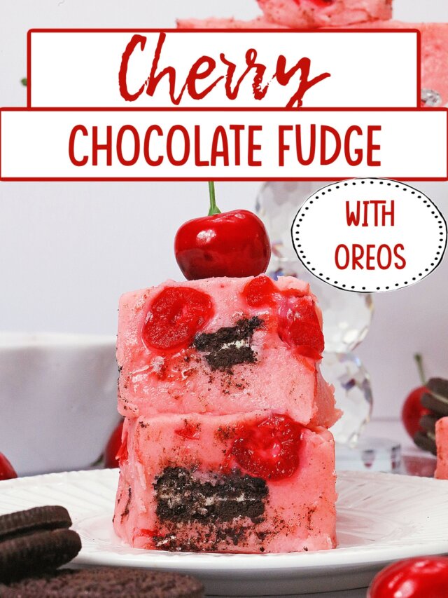two slices on chocolate cherry fudge on a plate topped with a fresh cherry.