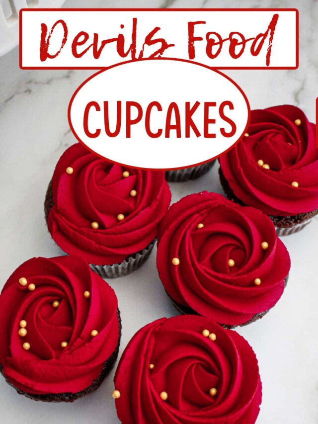rose frosted devils food cupcakes on a marble counter.