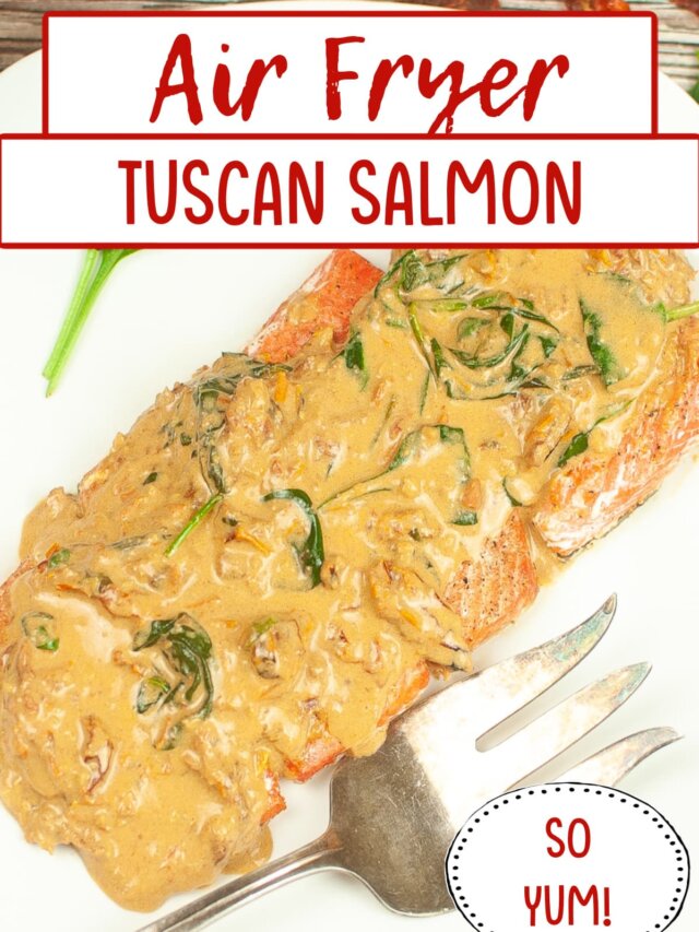 finished tuscan salmon on a white serving platter.