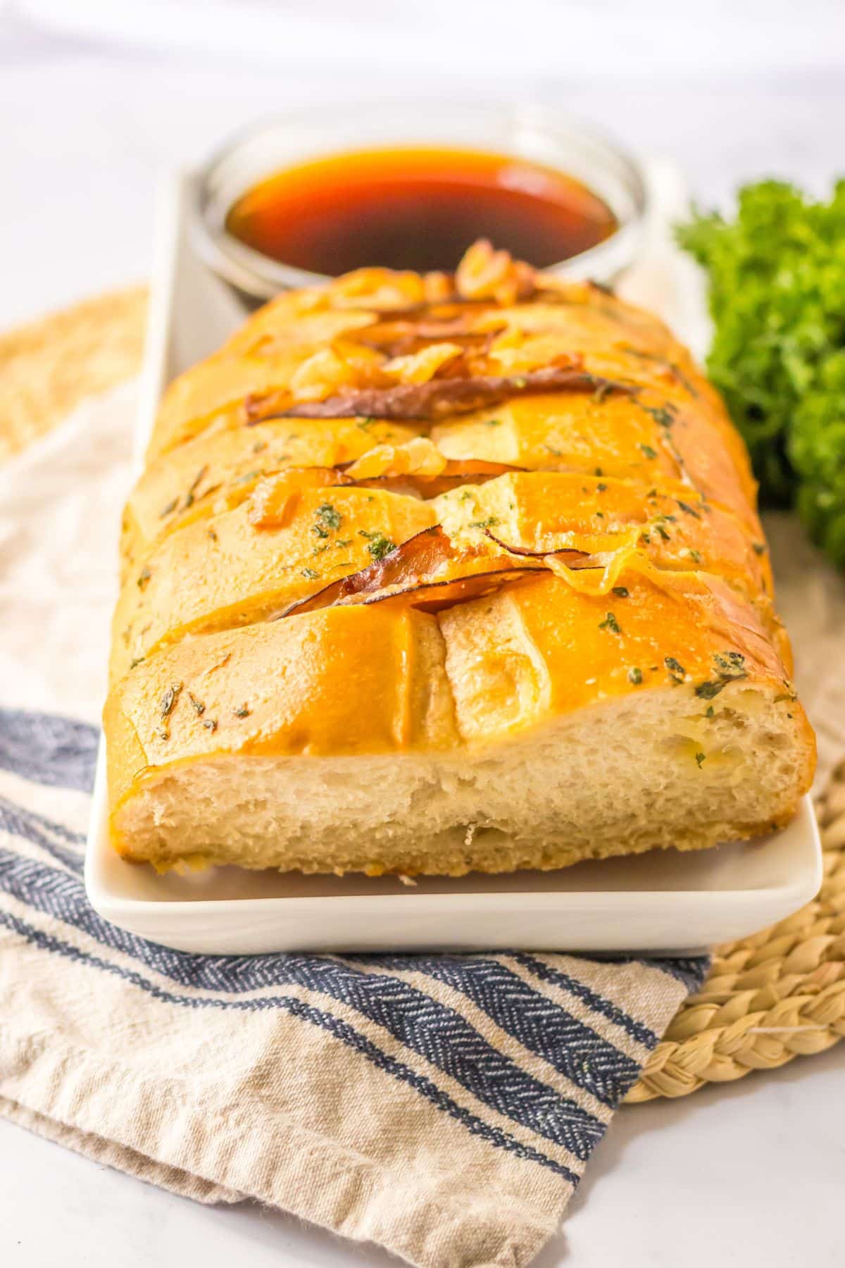 french dip pull apart bread on a serving platter.