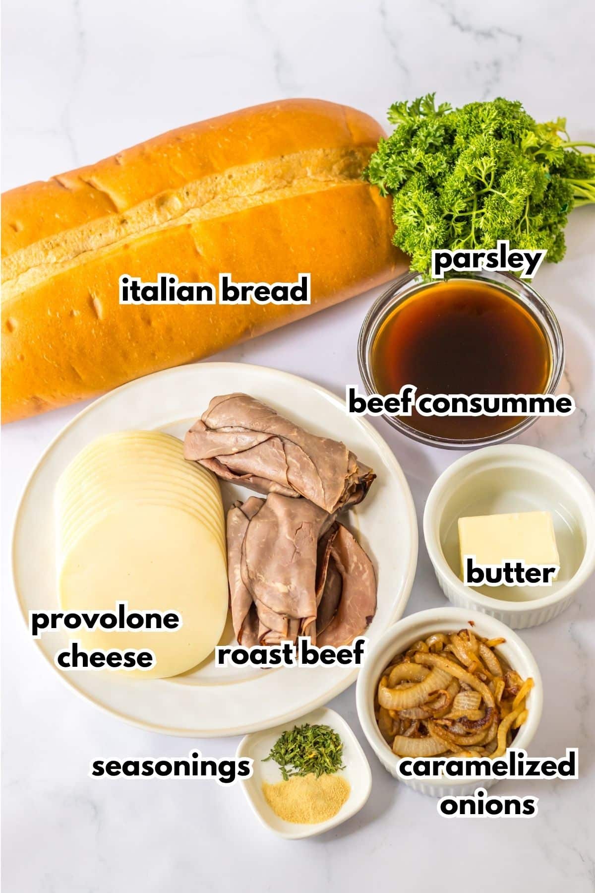 loaf of italian bread, provolone cheese, roast beef, parsley, beef consumme, butter, seasonings, and caramelized onions.
