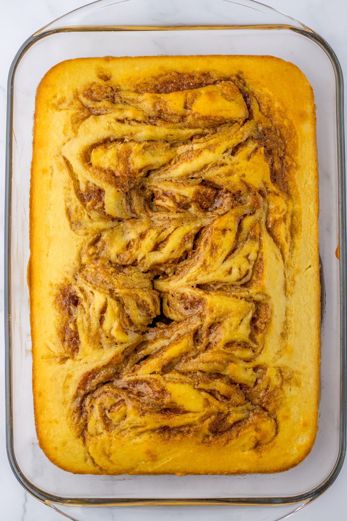 cake cinnamon swirl cake in a glass baking dish.
