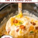 spoonful of ham potato soup held in the air above a slow cooker.
