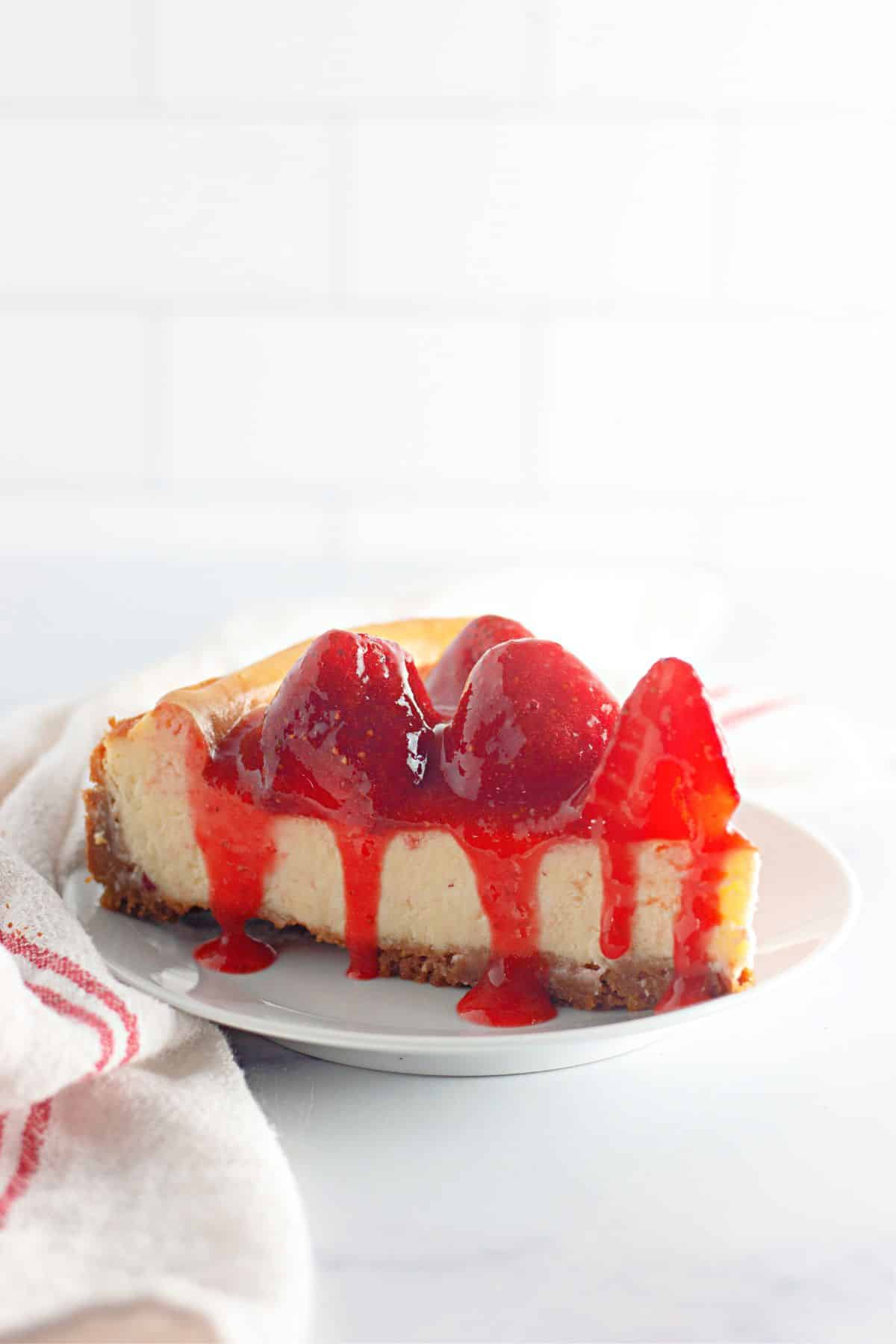 slice of new york cheesecake on a small plate.