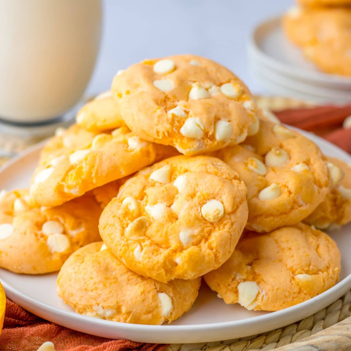 stack of orange creamsicle cookies on a plate.