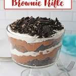 trifle bowl filled with oreo brownie trifle on a counter.