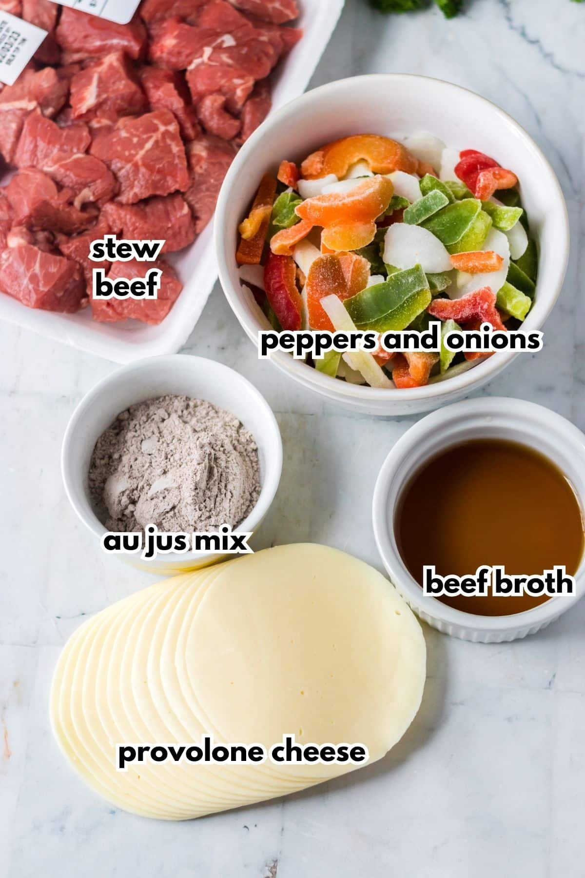 bowls of stew beef, peppers and onions, au jus mix, beef broth and slices of provolone cheese.