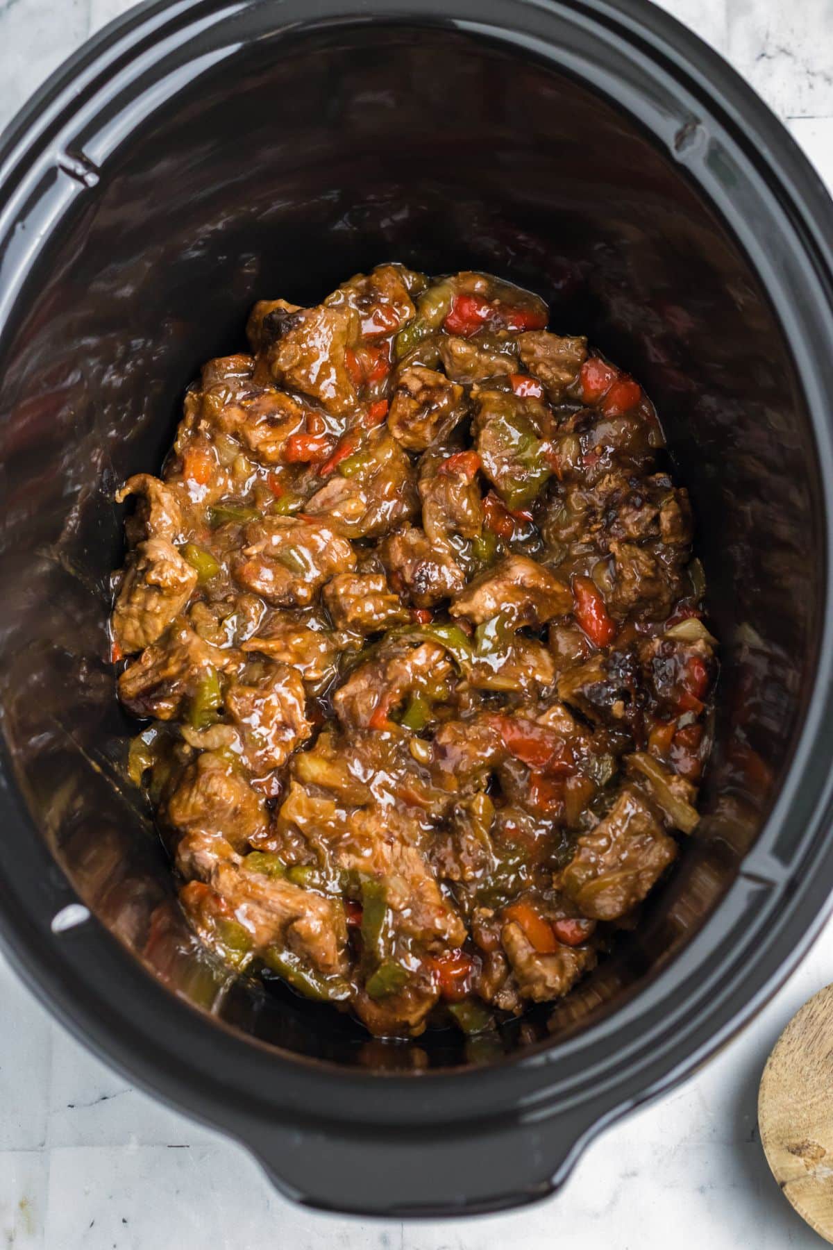 cooked philly cheesesteak bites in a slow cooker.