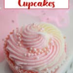 pink champagne cupcake on a marble counter.