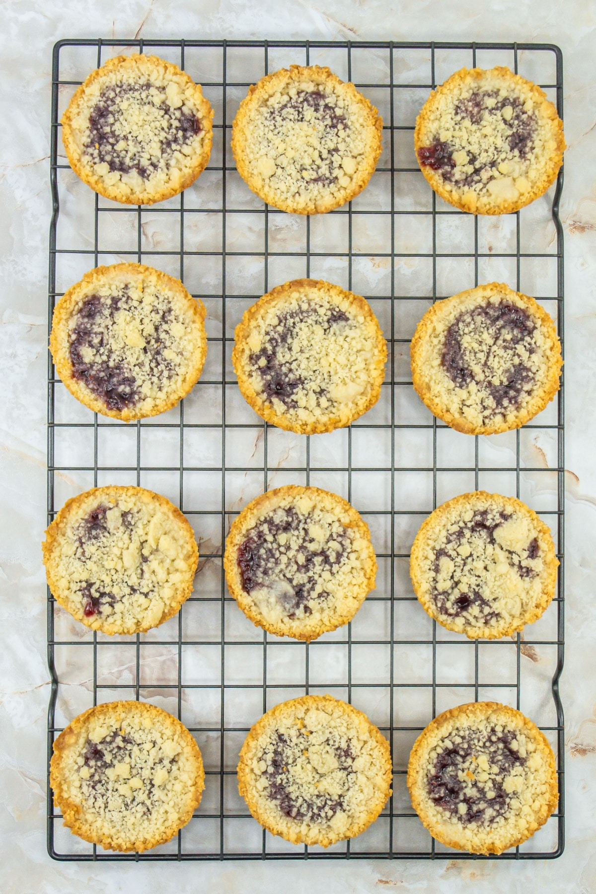 raspberry crumble cookies cooling on a wire rack.