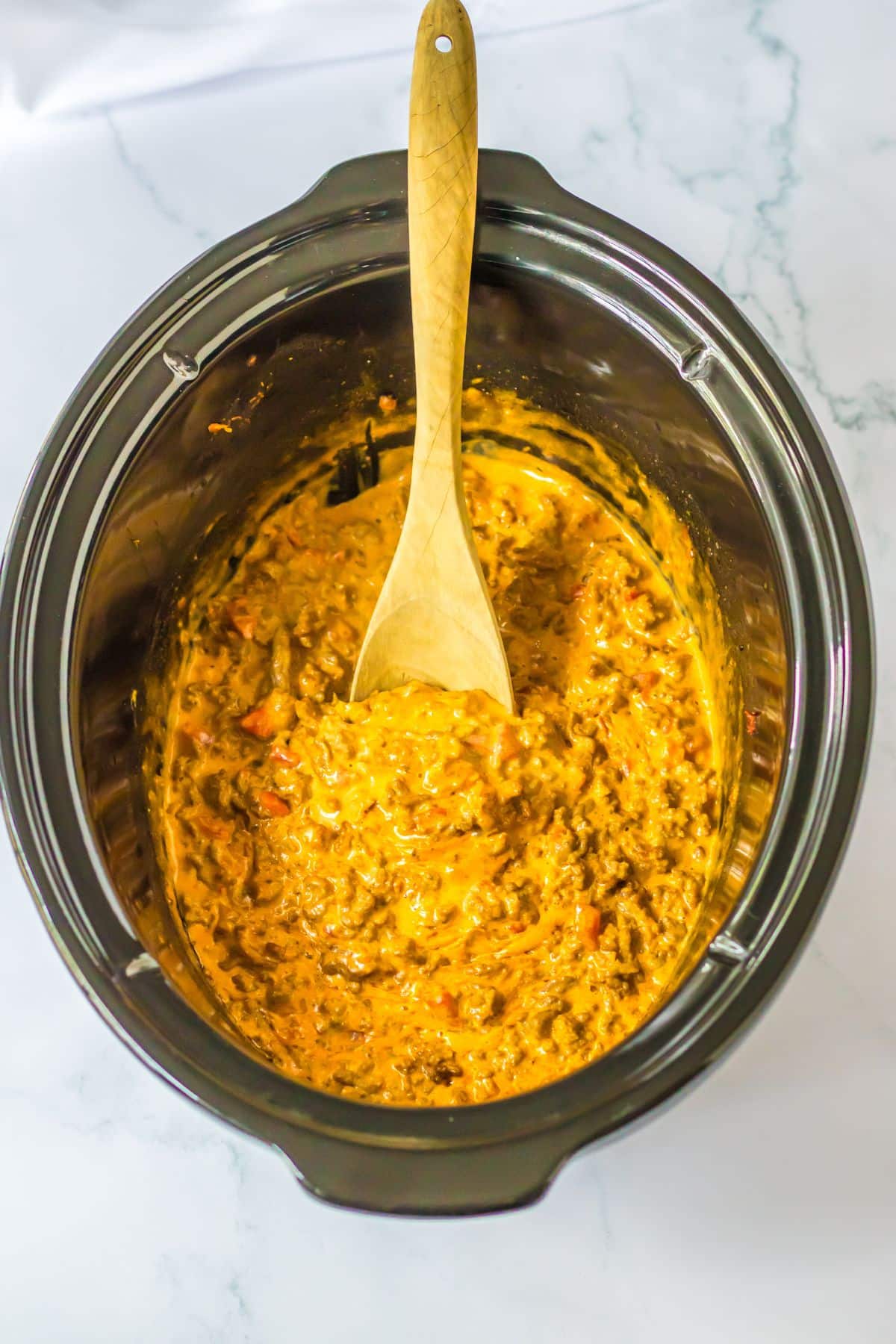 slow cooker full of rotel taco meat.