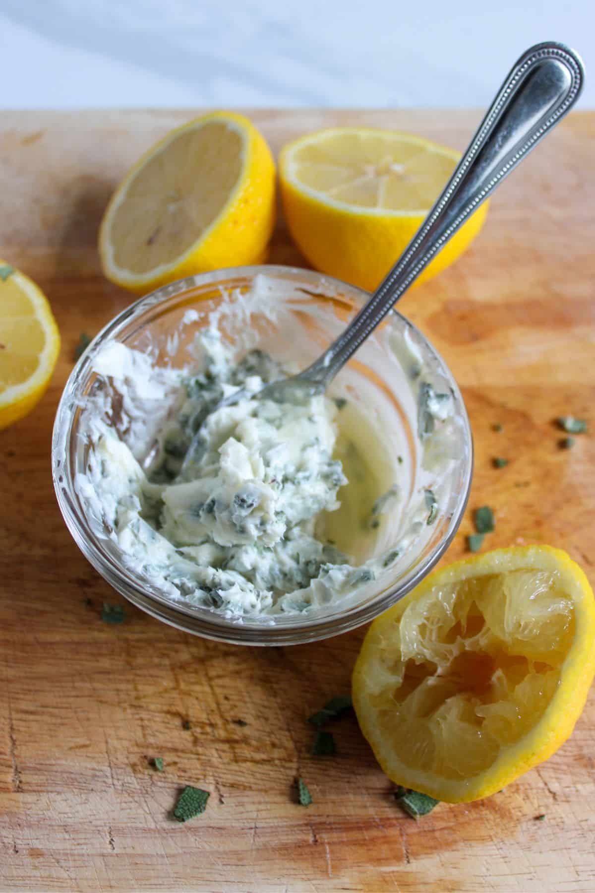 sage, lemon juice, and butter being mixed together in a small bowl.