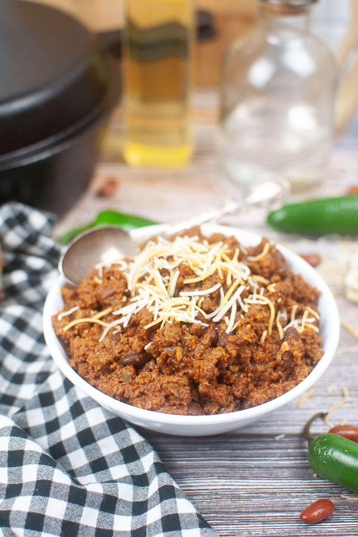 bowl of texas roadhouse chili with a spoon inside the bowl.