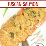 finished tuscan salmon on a white serving platter.