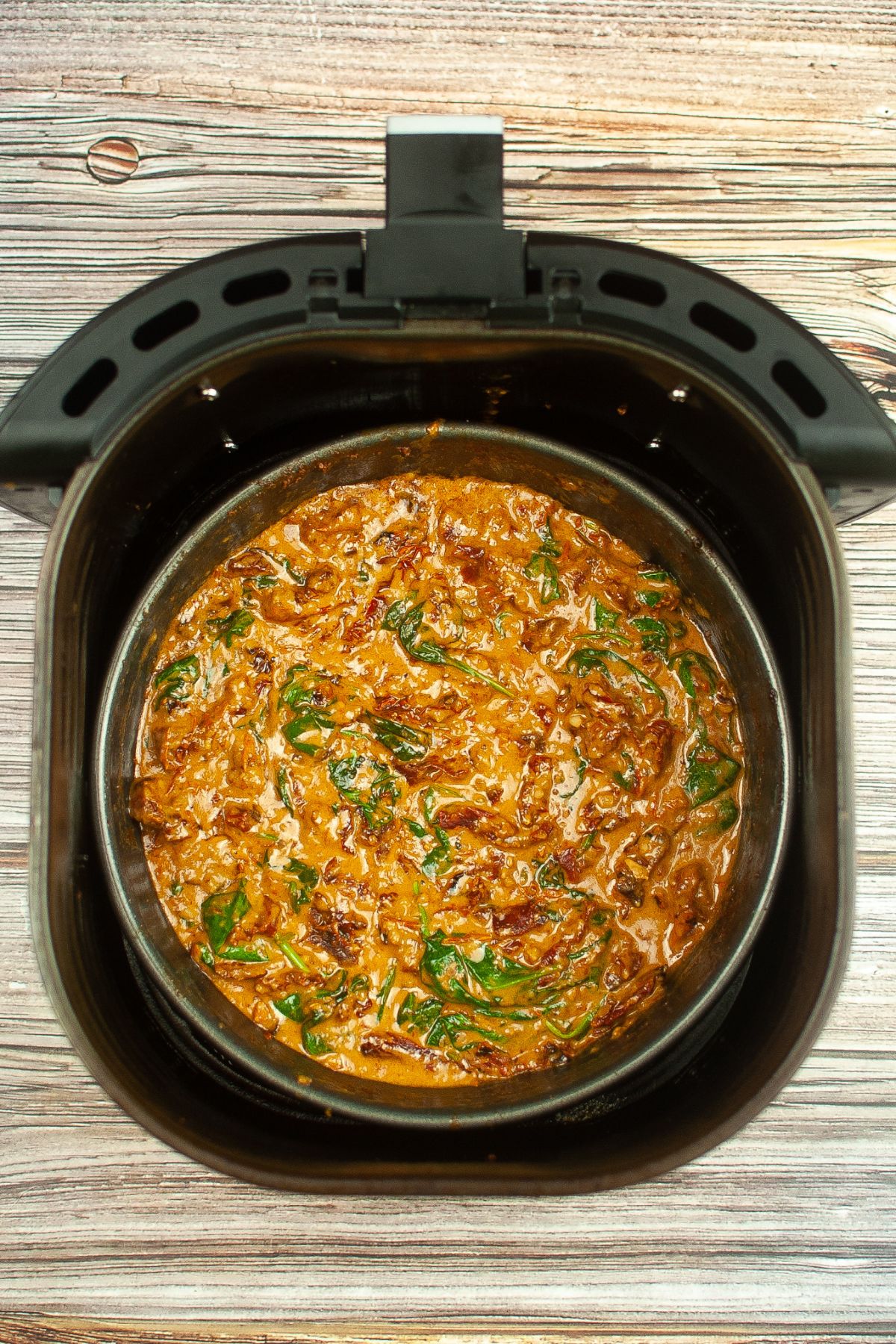 tuscan sauce instead a cake pan inside the air fryer basket.