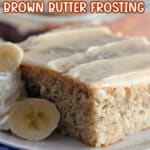 slice of banana cake with brown butter frosting on a plate.