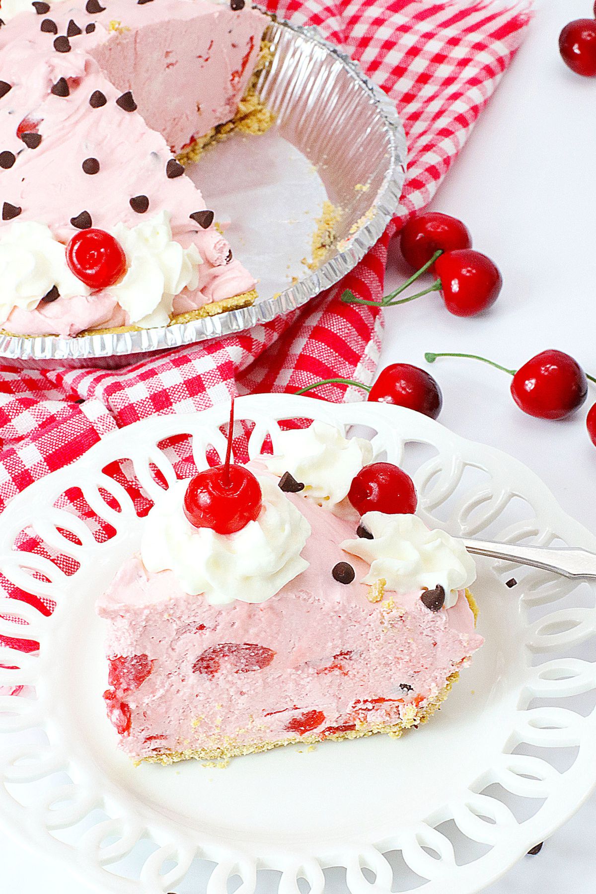 slice of chocolate cherry pie on a white plate.