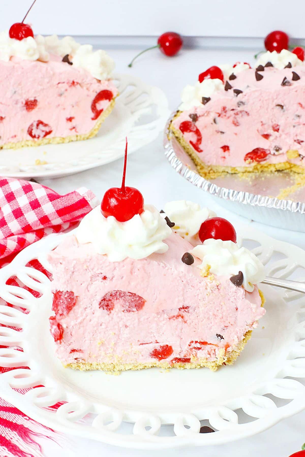slice of chocolate cherry pie on a white plate.