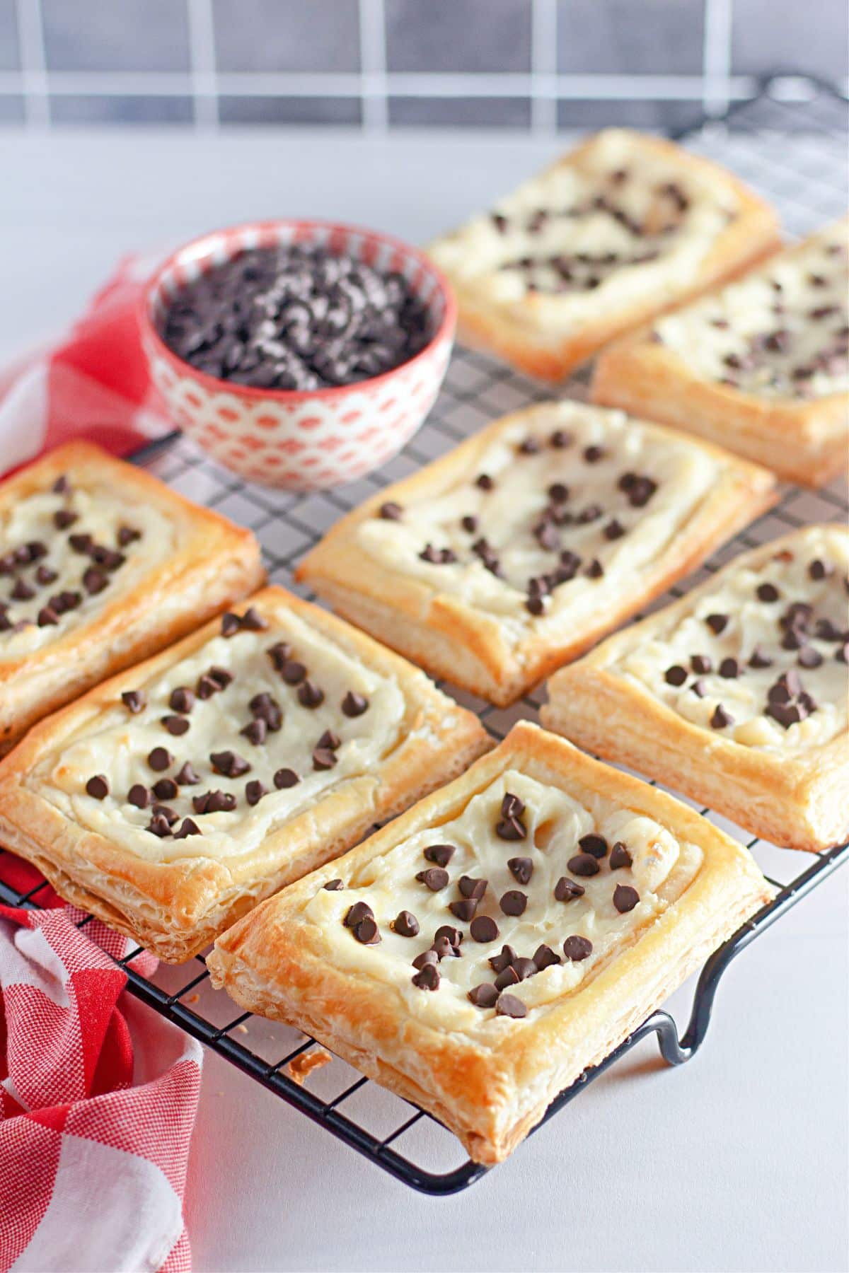 baked chocolate chip danishes on a cooling rack.