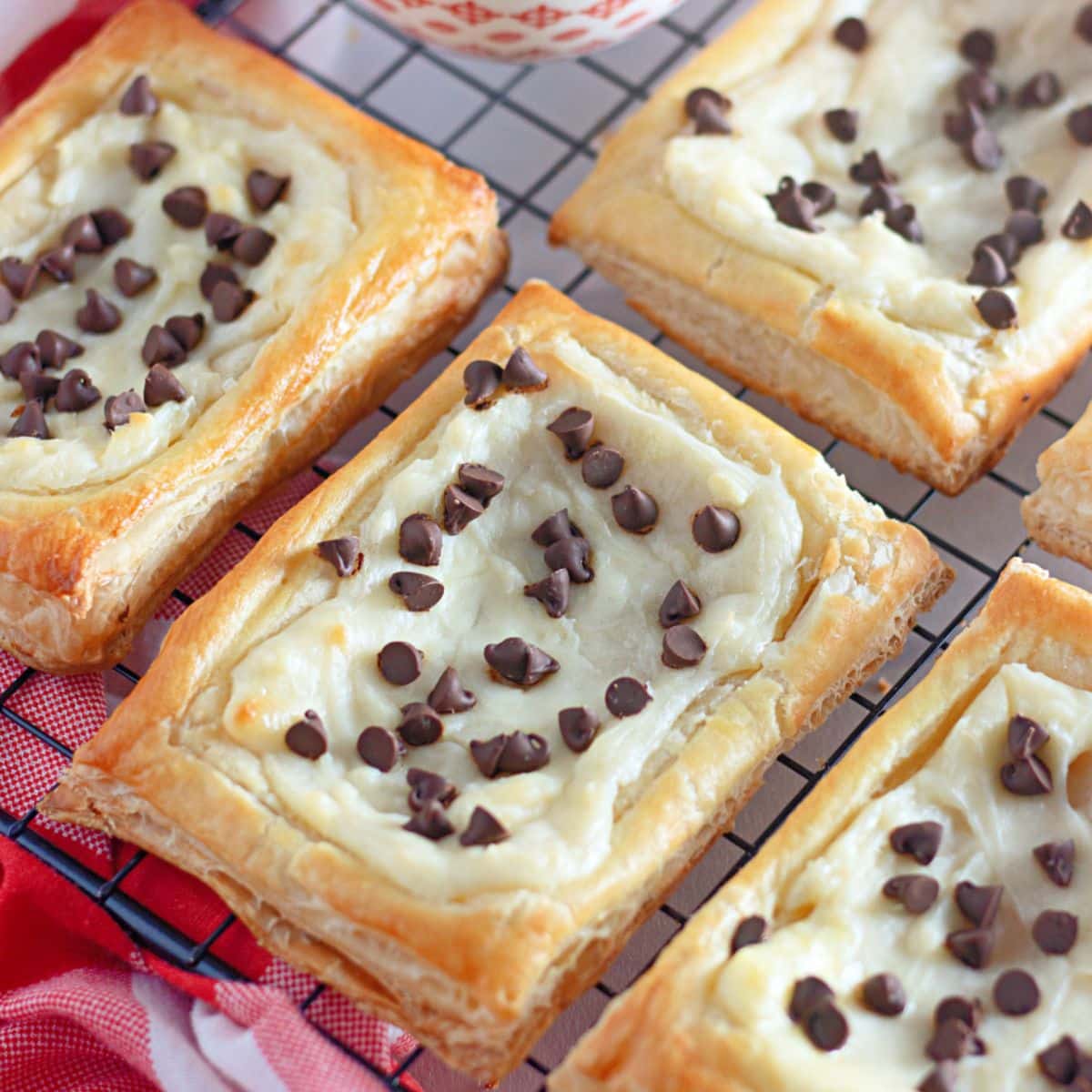 baked chocolate chip danishes on a cooling rack.