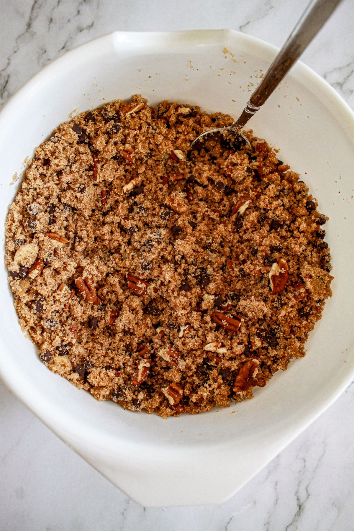 crumb topping in being mixed in a small bowl.