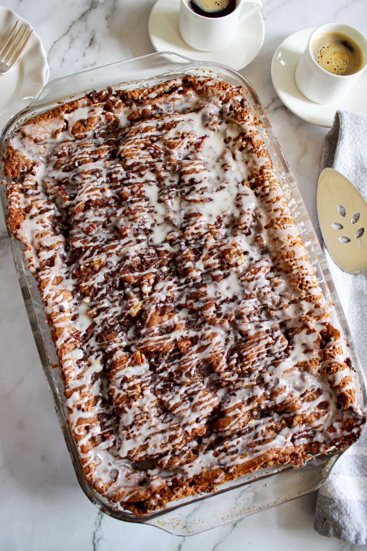finished chocolate orange coffee cake in a glass baking dish.