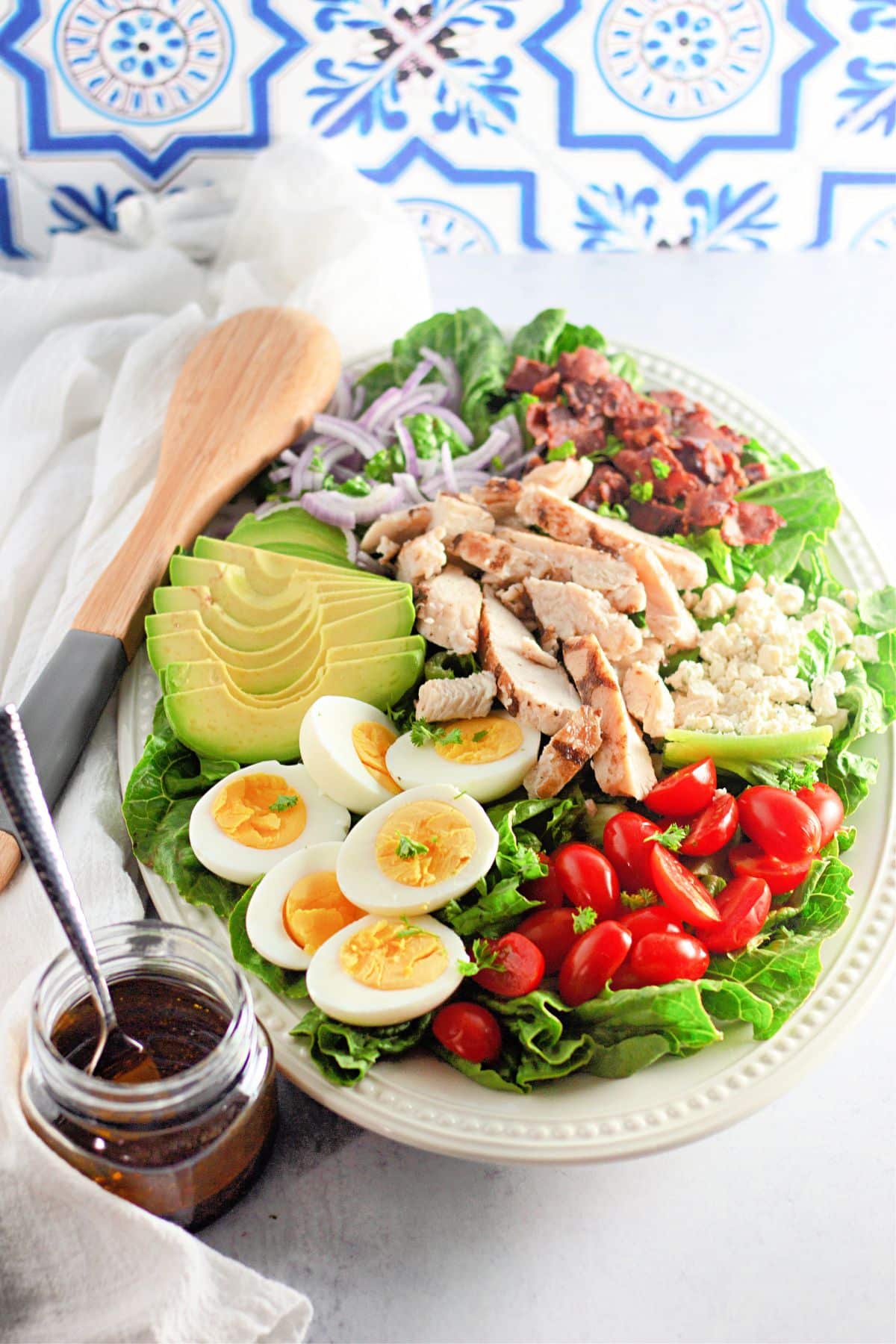 cobb salad layered on a large serving platter.