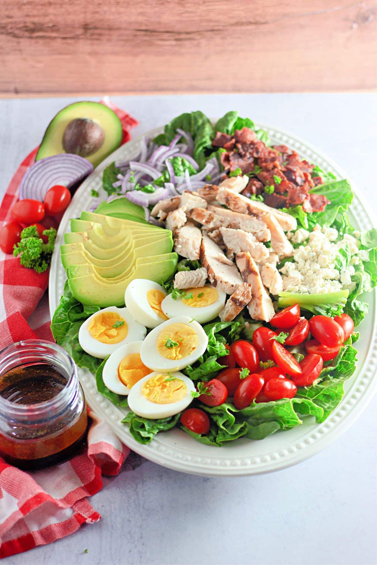 cobb salad layered on a large serving platter.