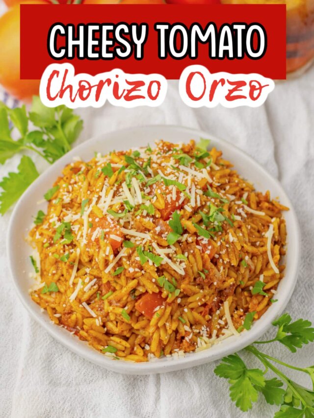 serving bowl full of cheesy tomato chorizo orzo.