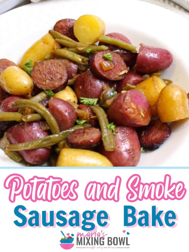 bowl full of potatoes and smoked sausage on a table.