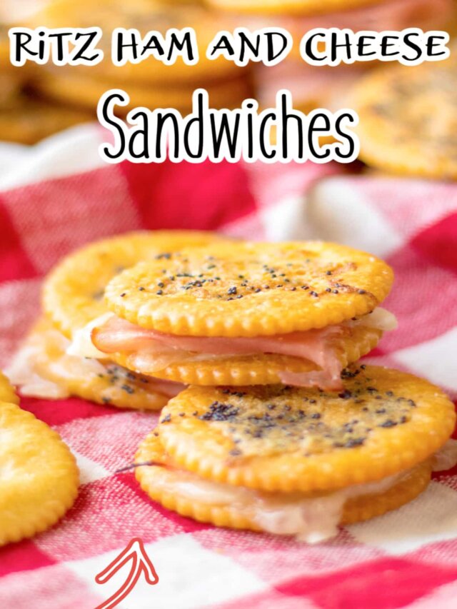 three ritz ham and cheese sandwiches stacked in a pyramid.