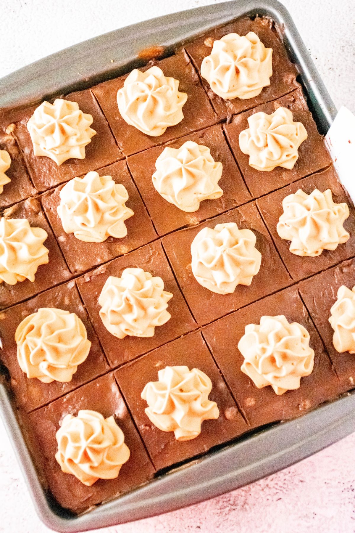 finished ferrero rocher cheesecake bars in a baking pan.