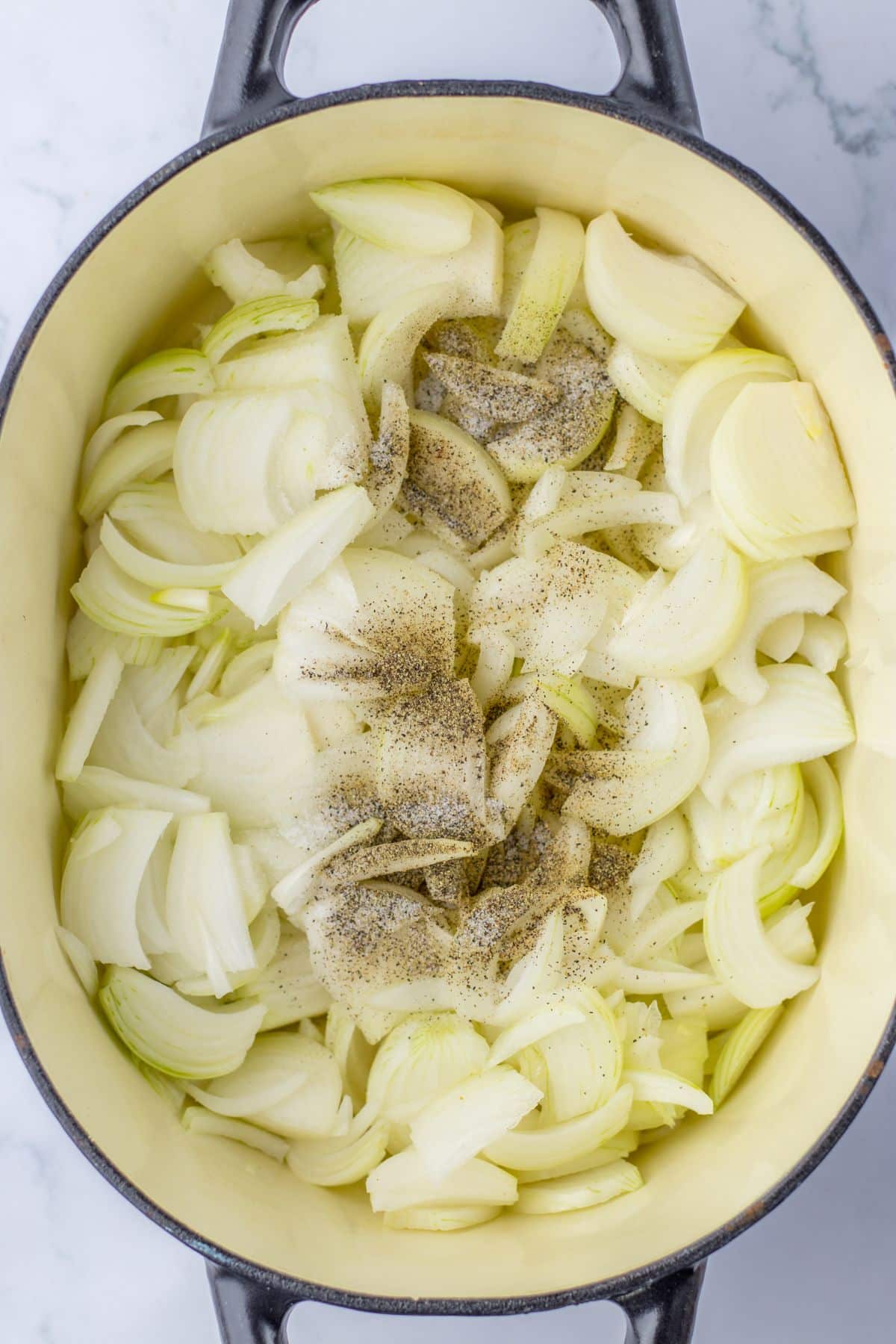 raw onions, salt and better in a large dutch oven.