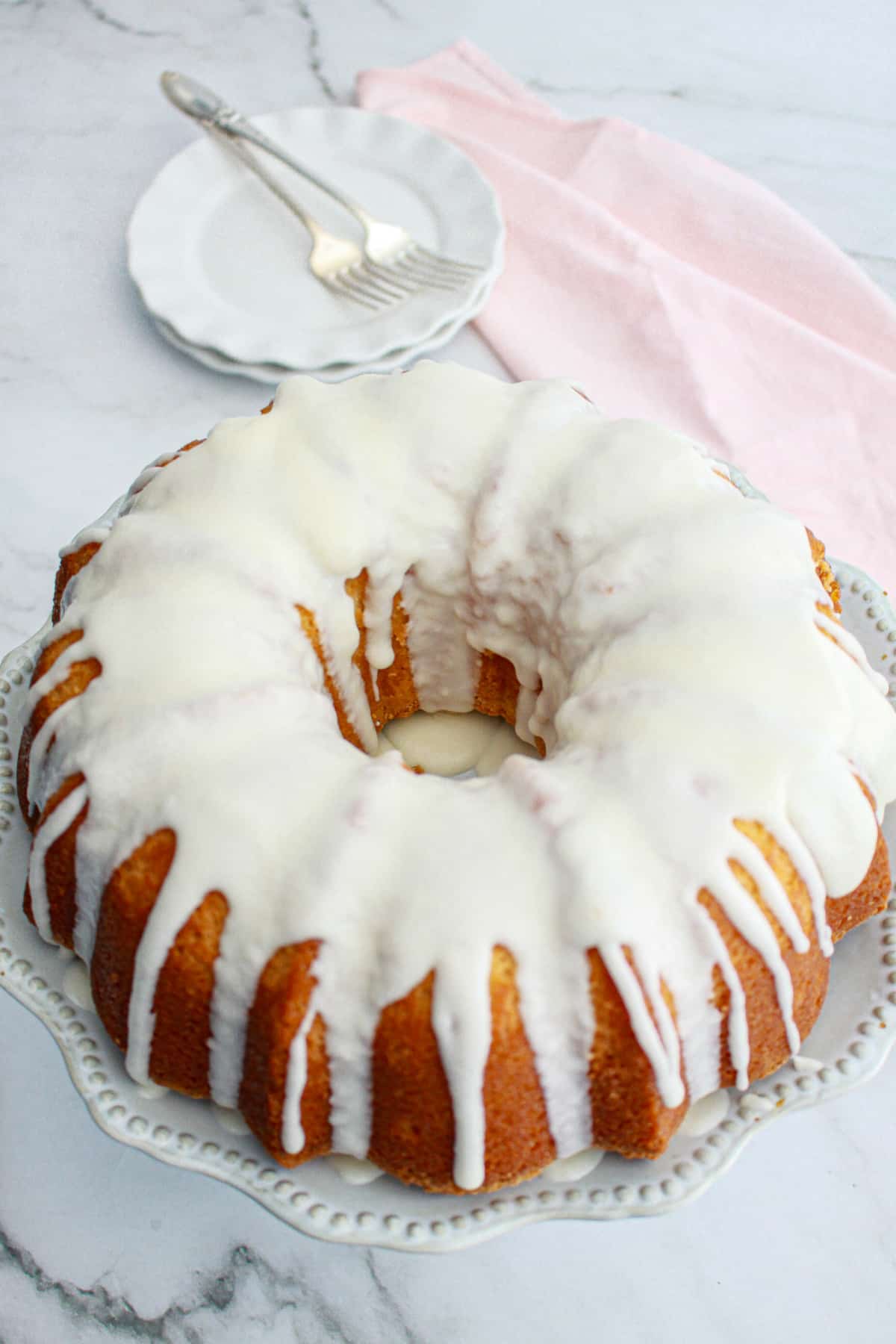 finished million dollar pound cake on a cake plate.