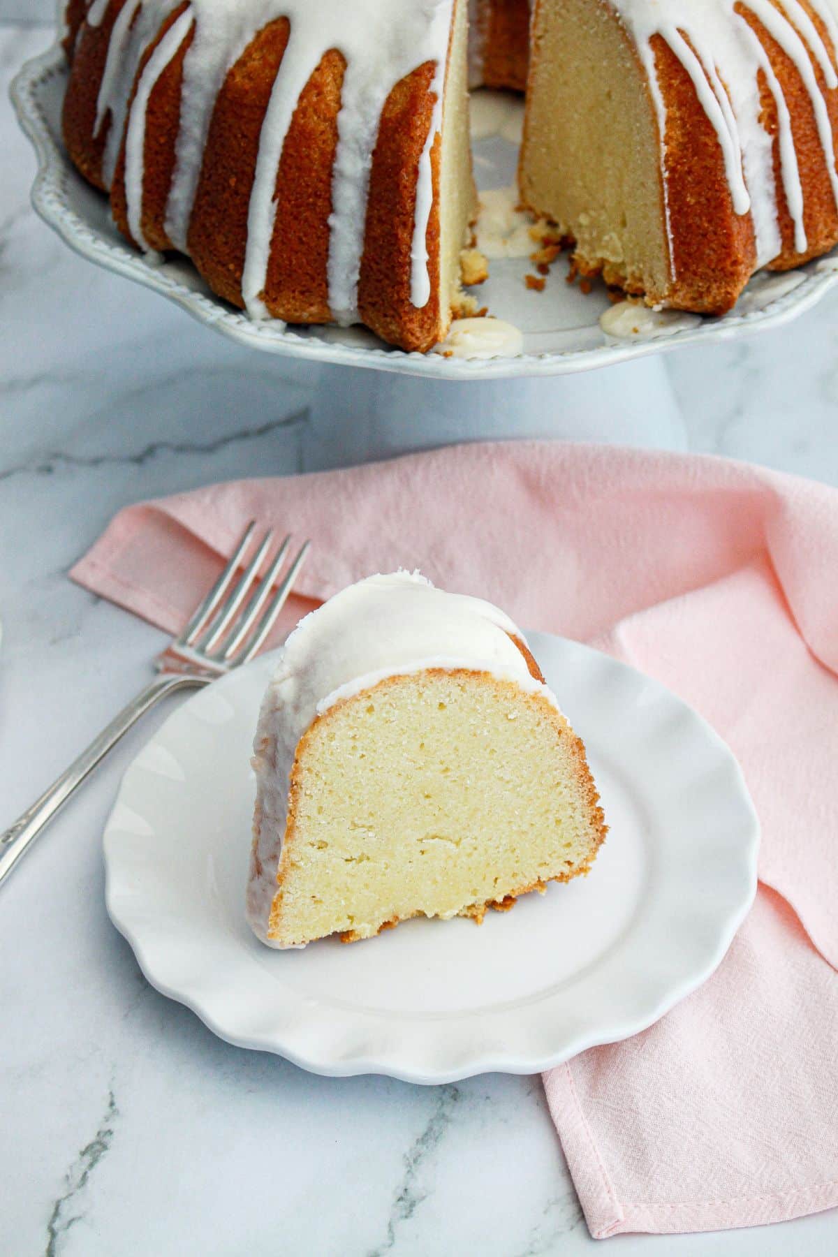 slice of million dollar pound cake on a plate.