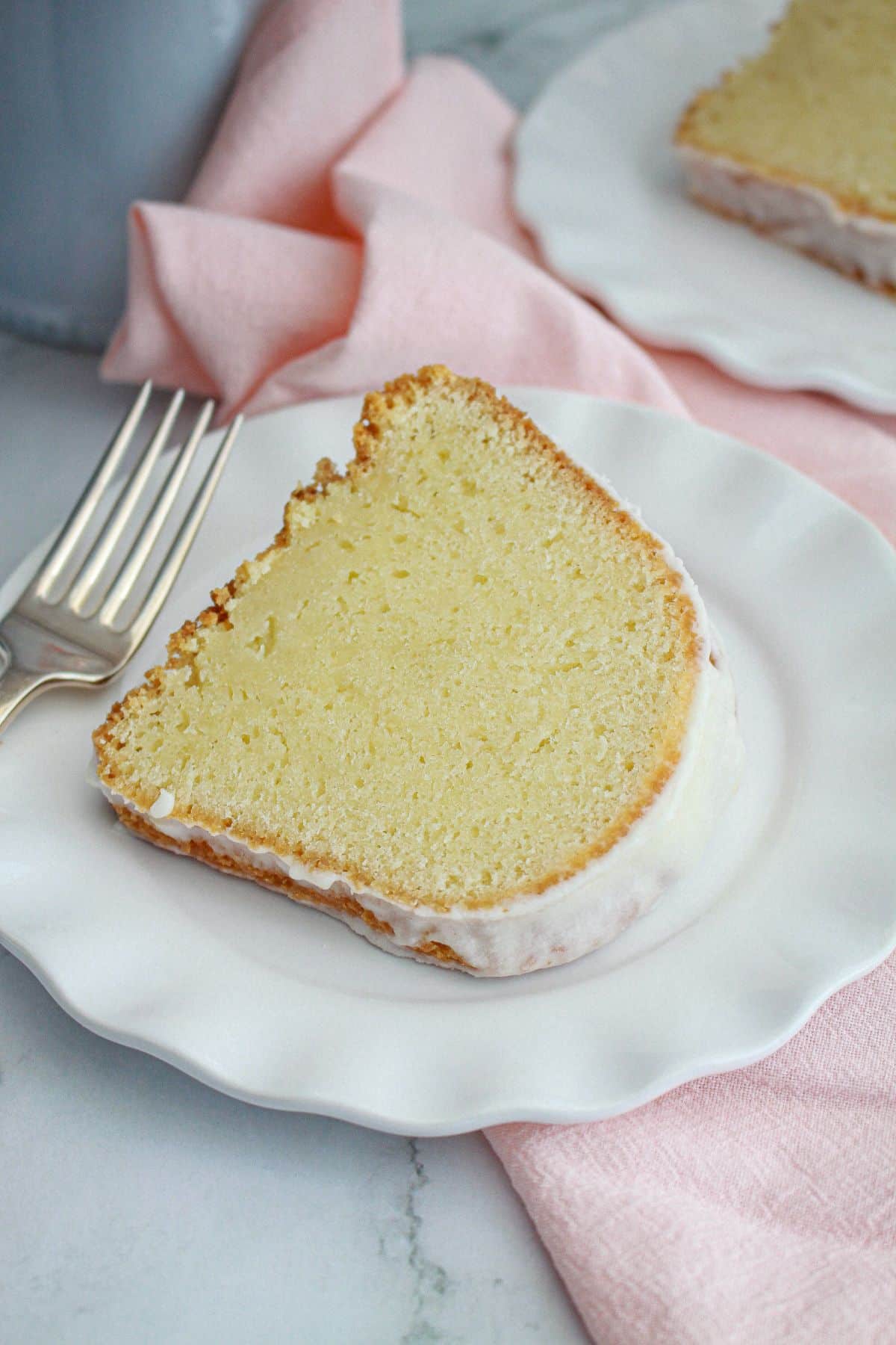slice of million dollar pound cake on a small plate.