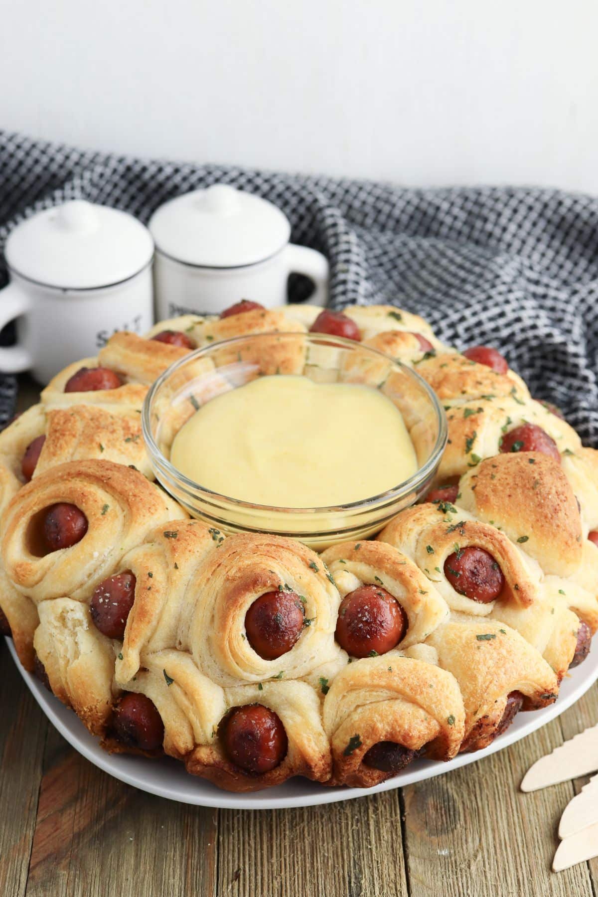 pigs in a blanket pull apart on a plate.